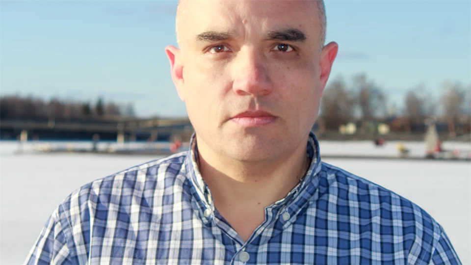 Portrait of a man outside in a winter landscape.