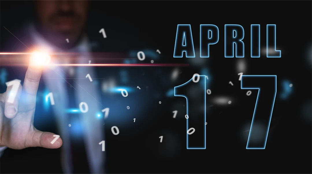 17 april. Dag 17 i månaden, reklam eller högteknologisk kalender, man i kostym trycker på ljusa virtuella knappen vårmånad, årets dag koncept.