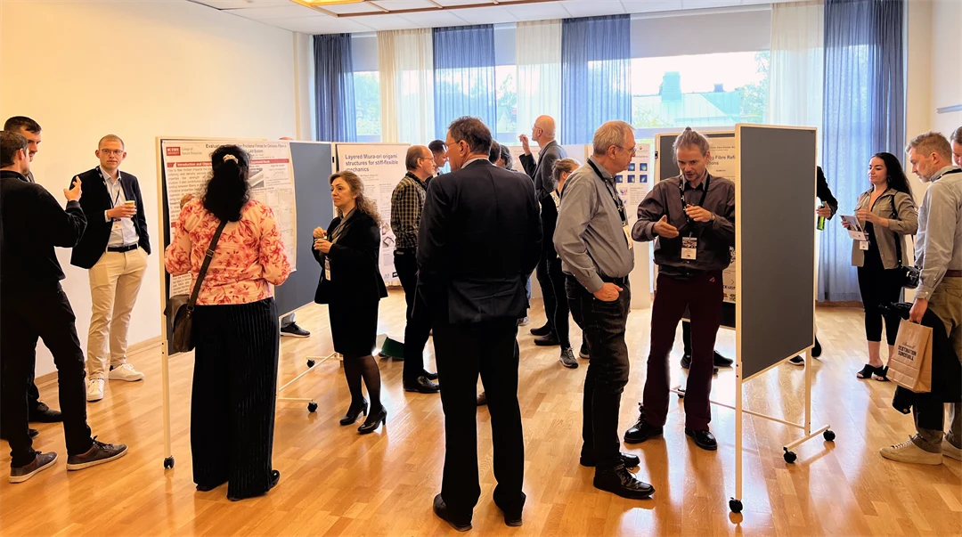 Men and women viewing research posters.
