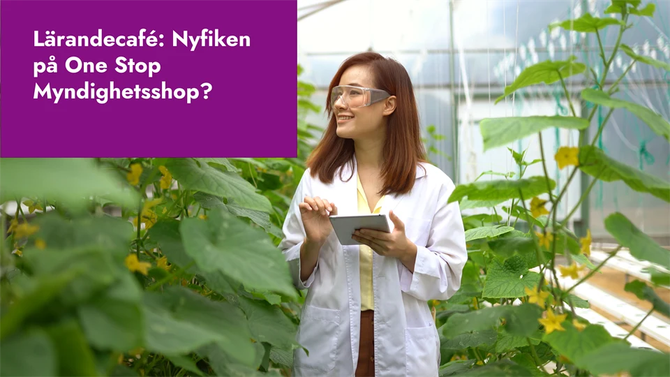 Kvinna i vit rock i ett växthus med plantor