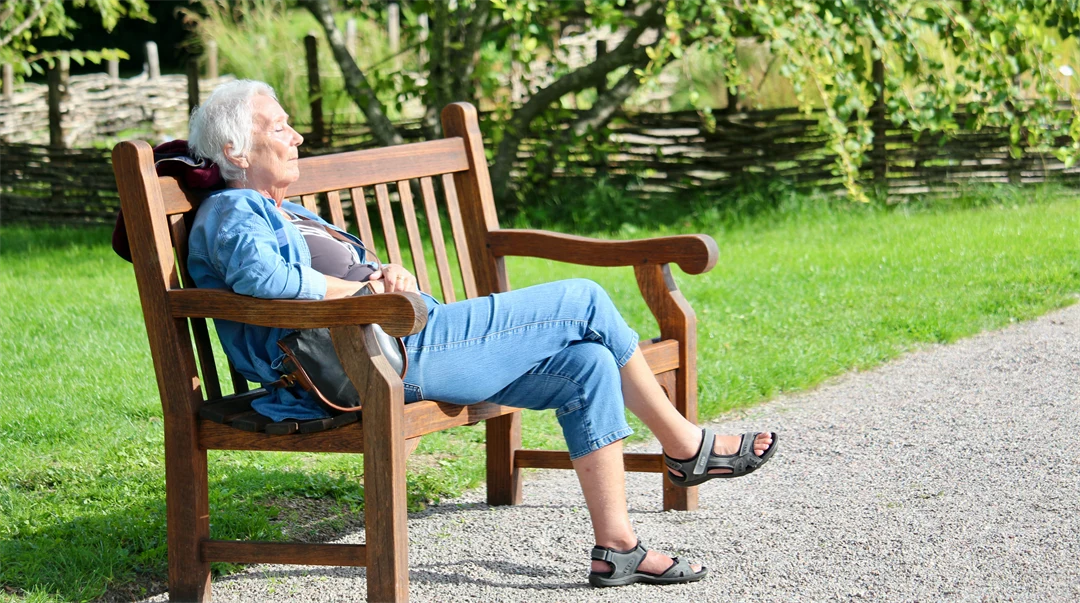 Elderly lady on a bench