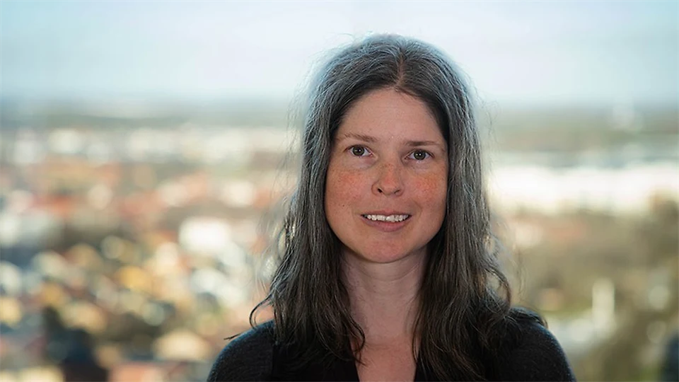A woman with long, dark hair