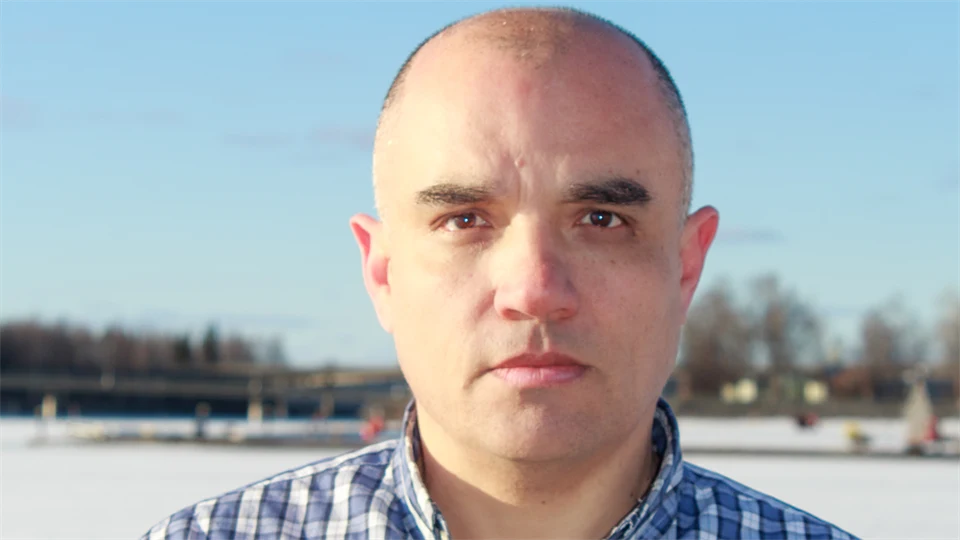 Portrait of a man outside in a winter landscape.