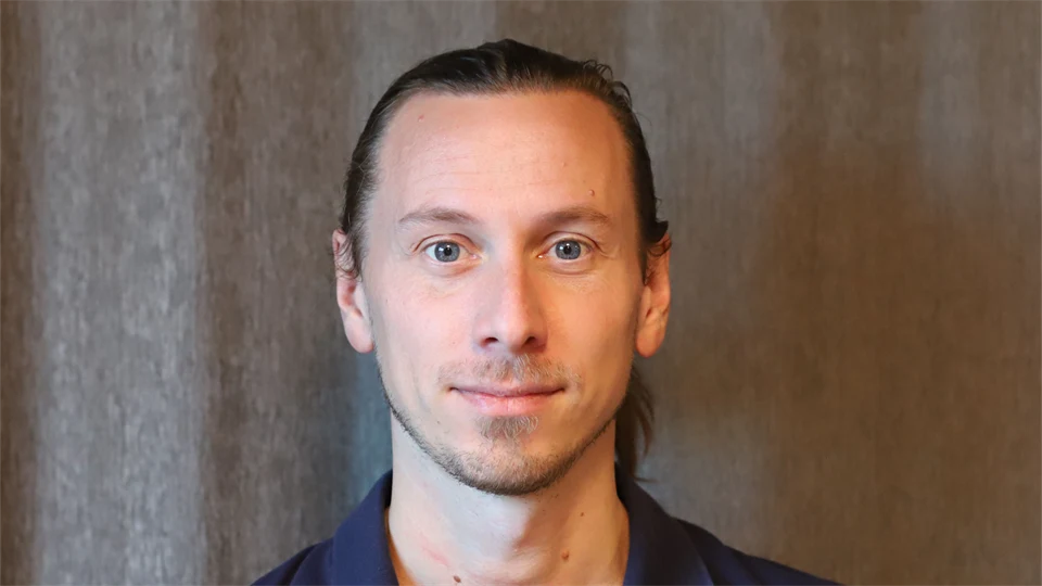 A man with a blue shirt