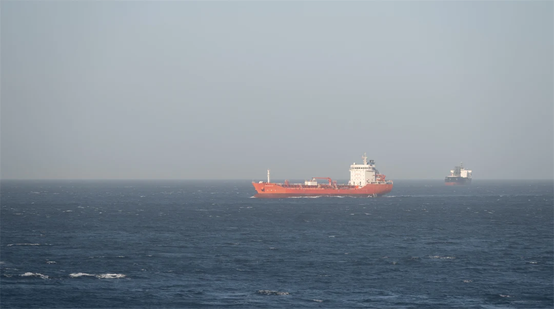 two large cargo ships on open-sea