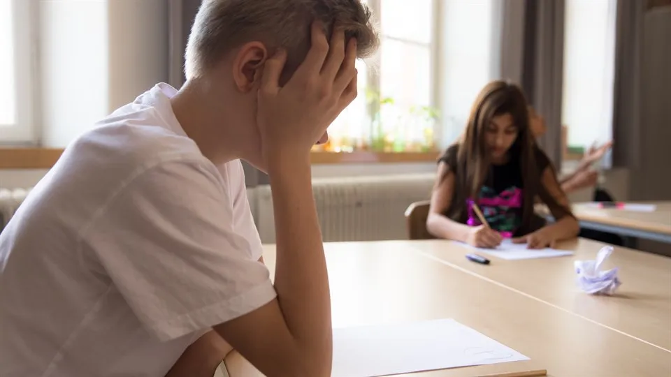 Boy struggling with a test i school