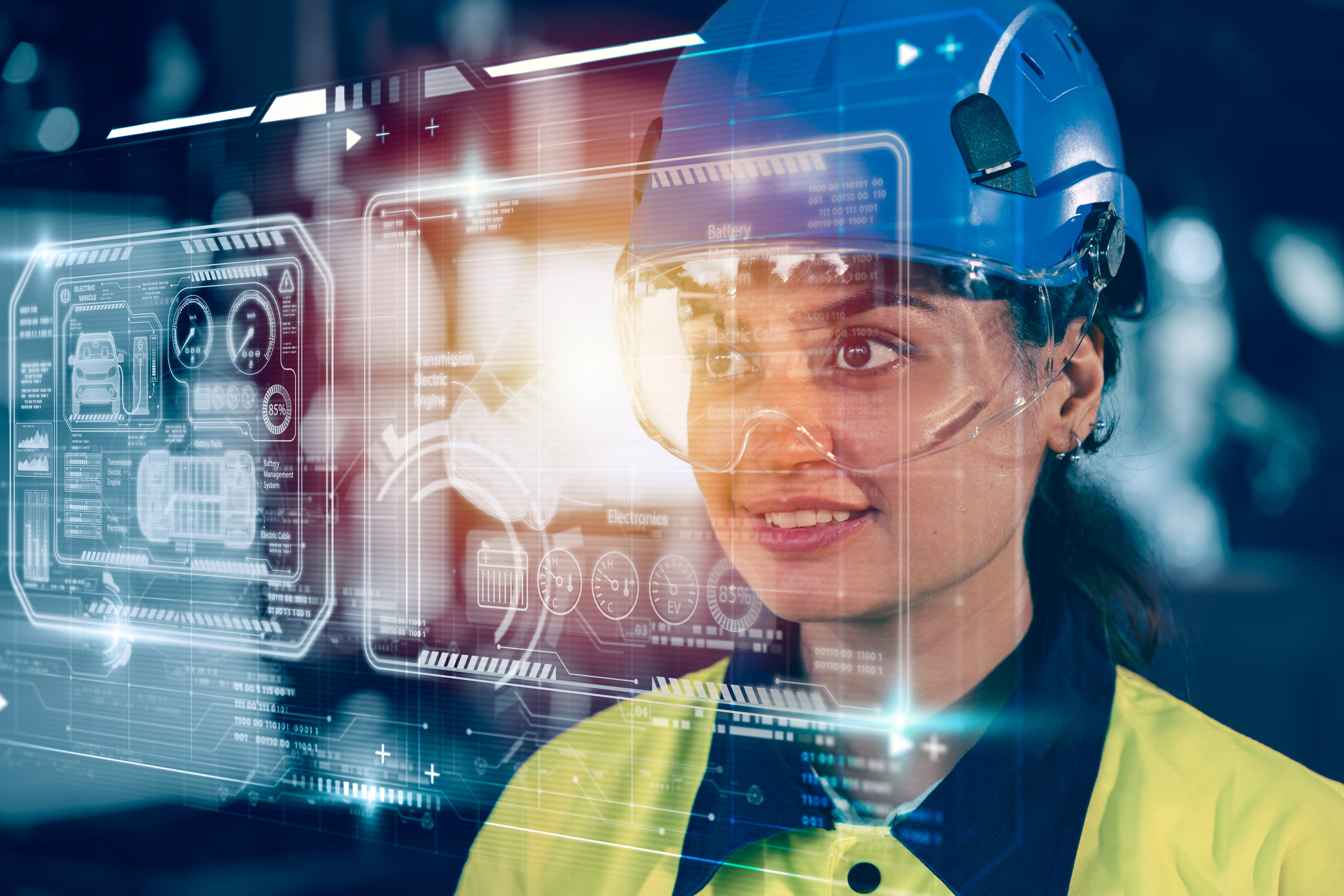 Woman in an industrial helmet looking at a AR layer with digital symbols