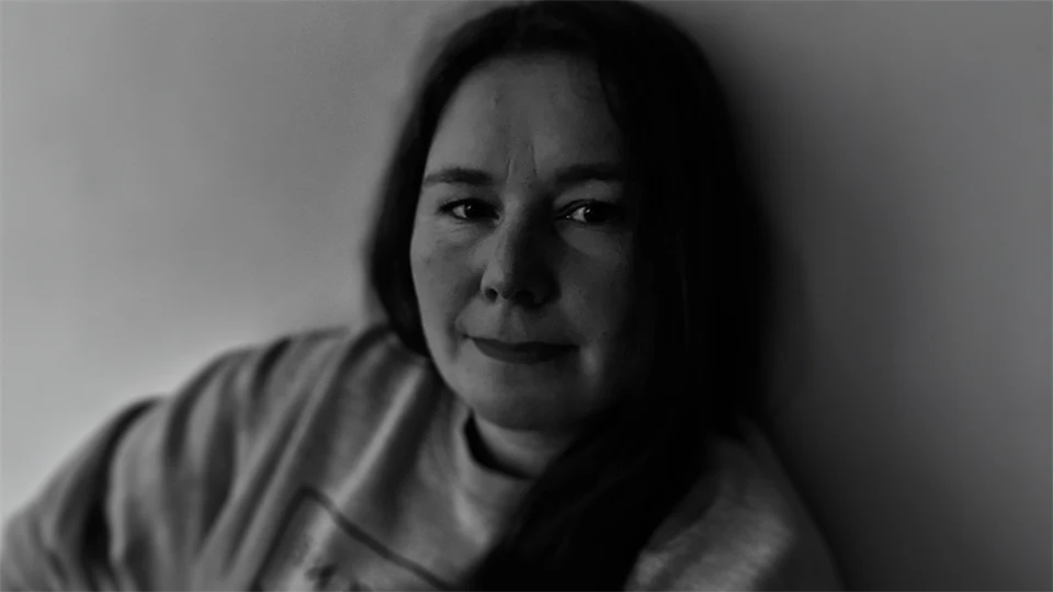 Black and white picture of woman with long hair. 