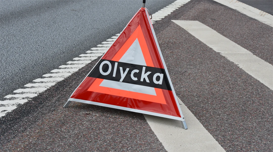 Varningstriangel med texten olycka.