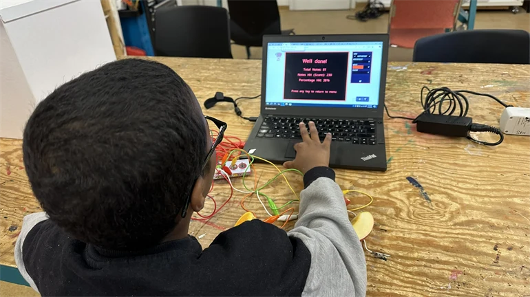 A pupil is trying electricity our Makerspace.