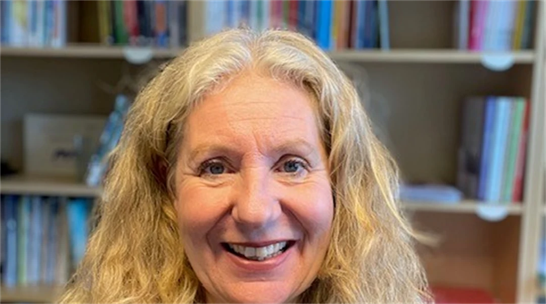 A portrait photo of a blonde woman