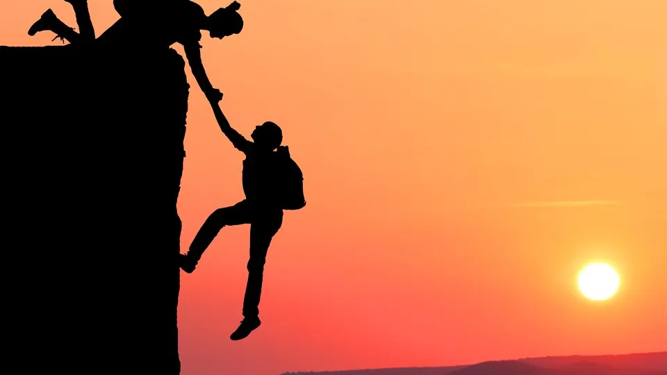 Teamwork couple hiking help each other trust assistance