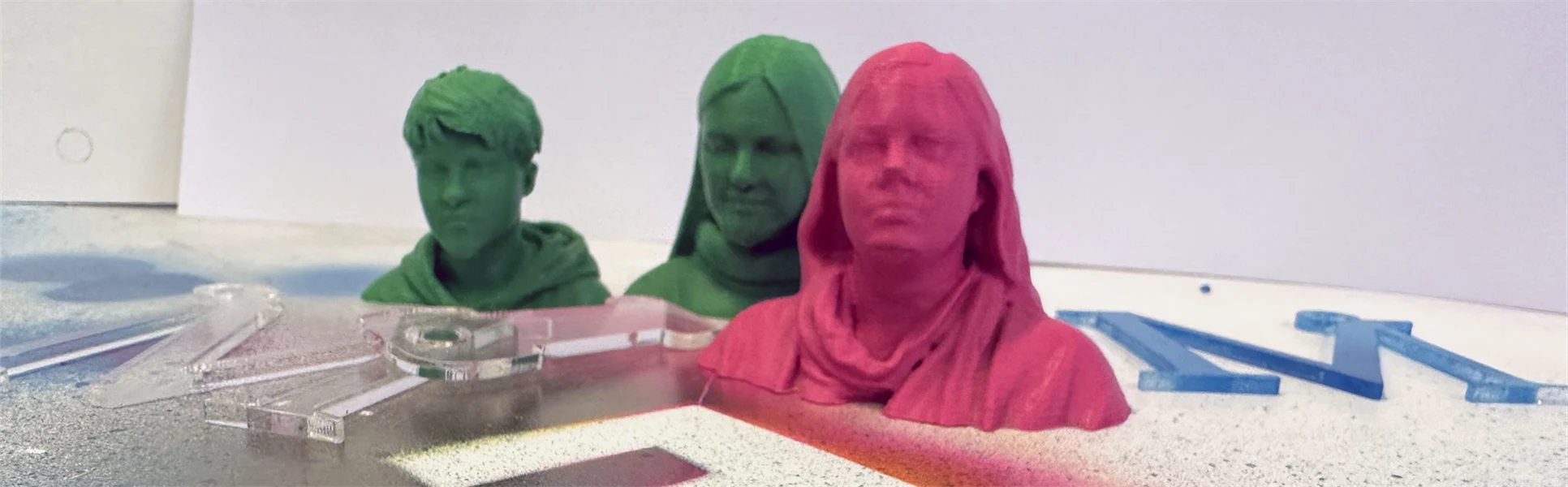 three small heads in plastic