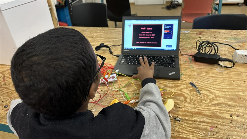 A pupil is trying electricity our Makerspace.