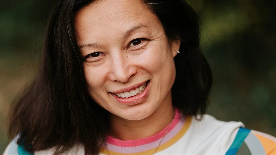A portrait photo of a woman with dark hair