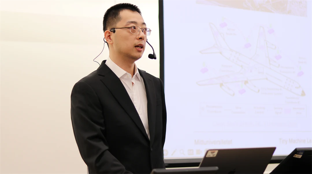 Yuxuan Zhang presents his work