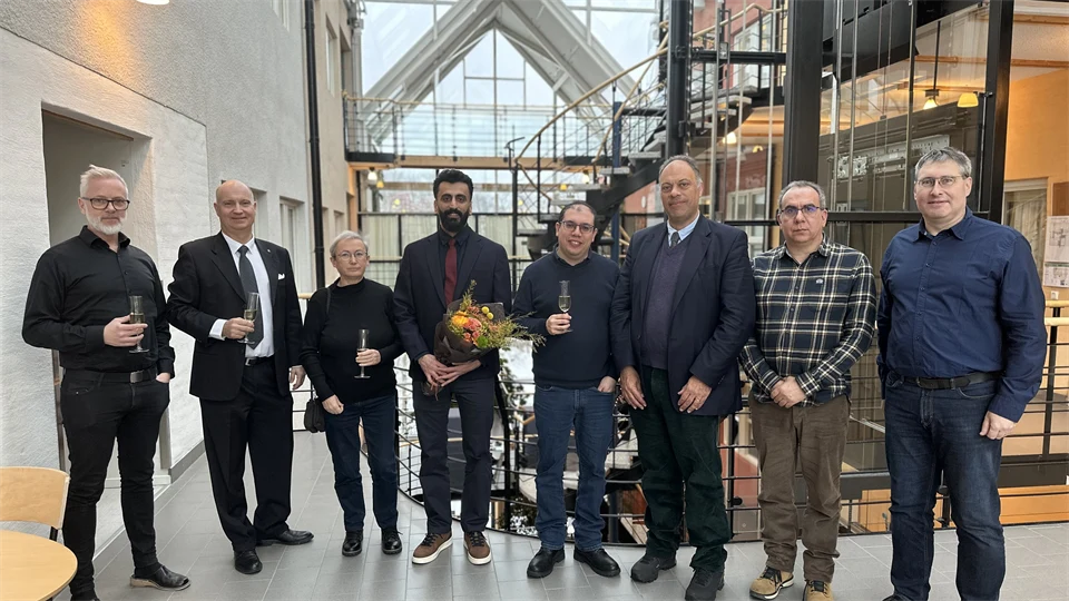 A group picture of eight well dressed people