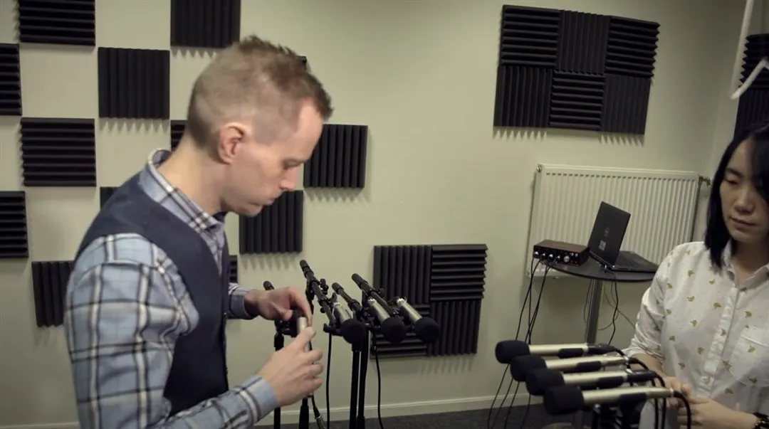 Jan Lundgren and Jiang Meng installing sound system.