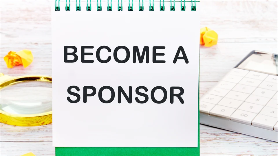  The text Become a sponsor is written in capital letters in a notepad.